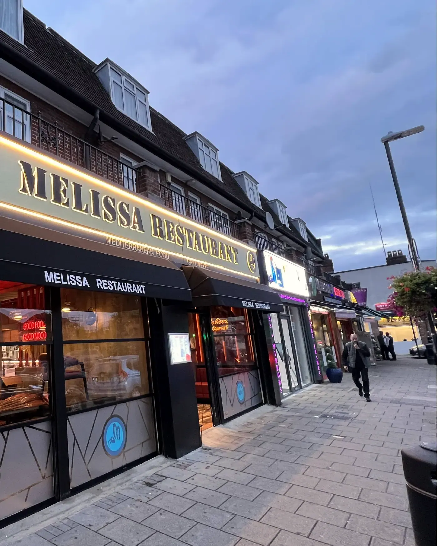 Halo-lit fascia at Melissa Restaurant, Canons Park, at dusk