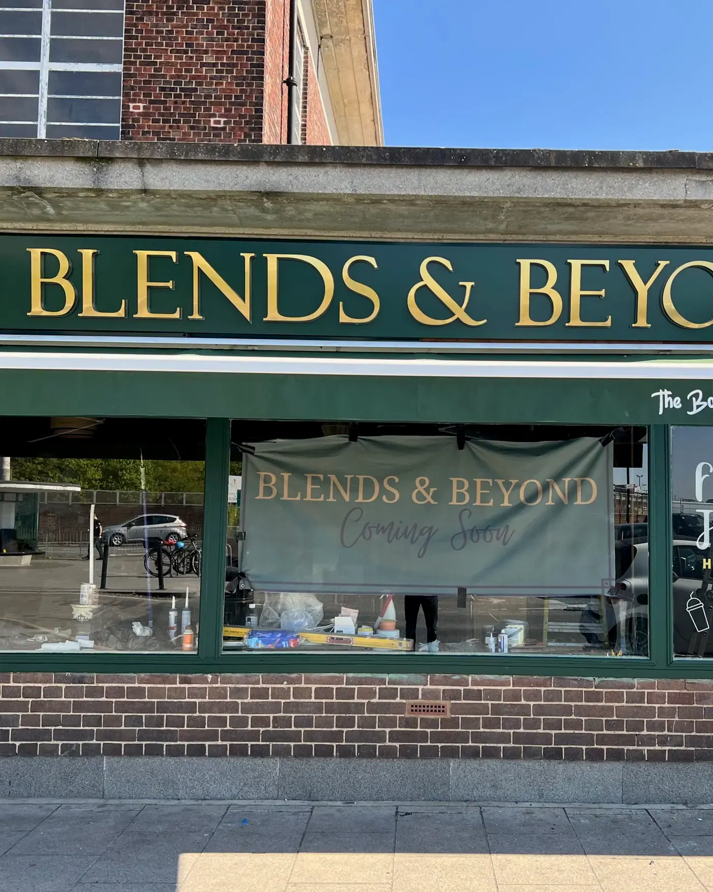 Blends & Beyond shop front at Oakwood Station, green fascia with brushed gold letters
