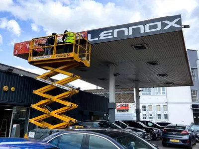 Sign installation from a scissor lift