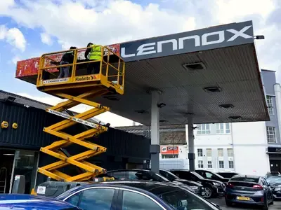 Sign installation from a scissor lift