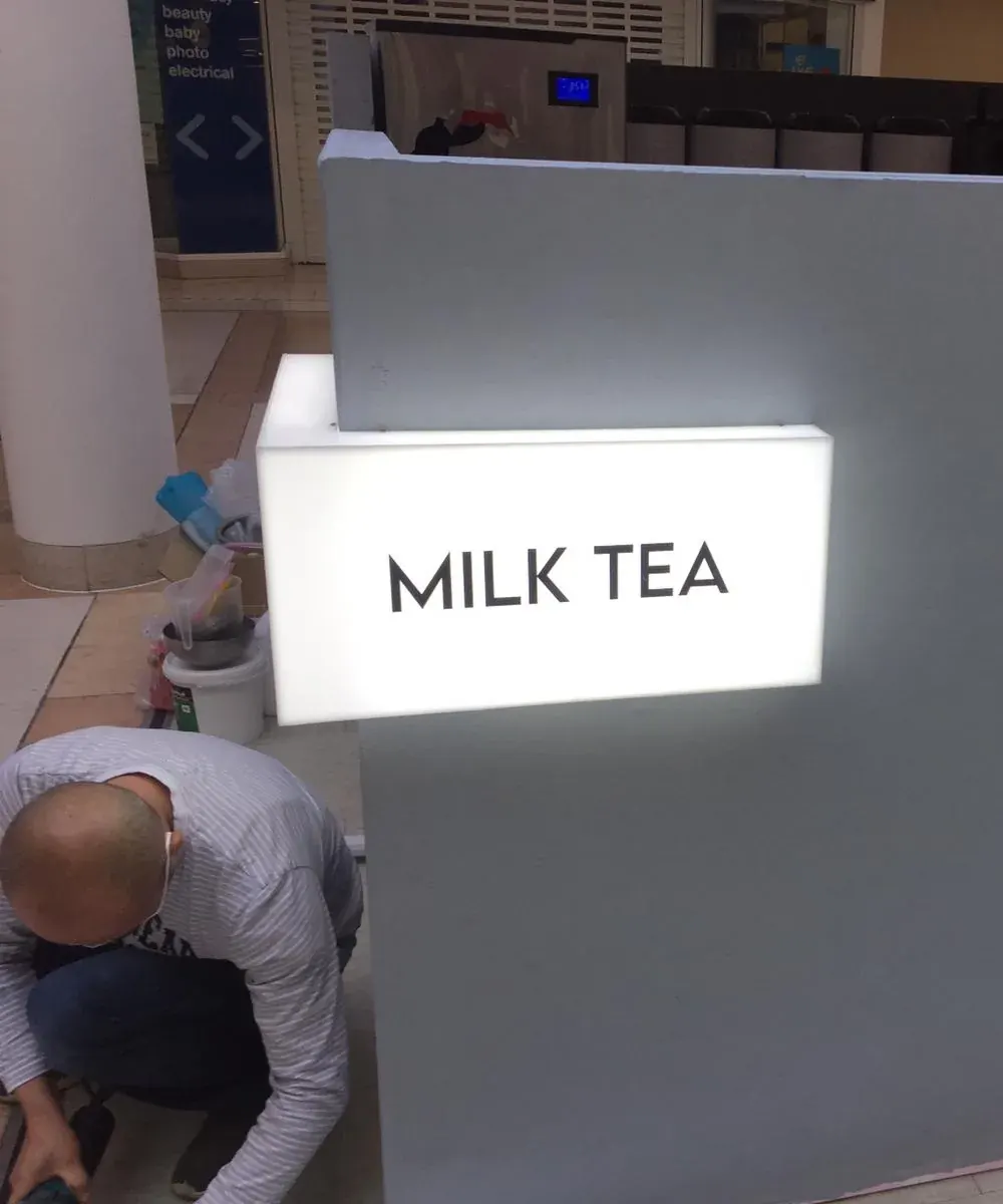 Fitting the illuminated lightbox on the Lucky Bubble kiosk