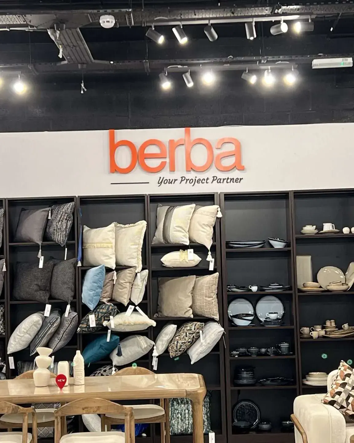 Raised orange Berba letters on the showroom wall above the display shelves, Twickenham