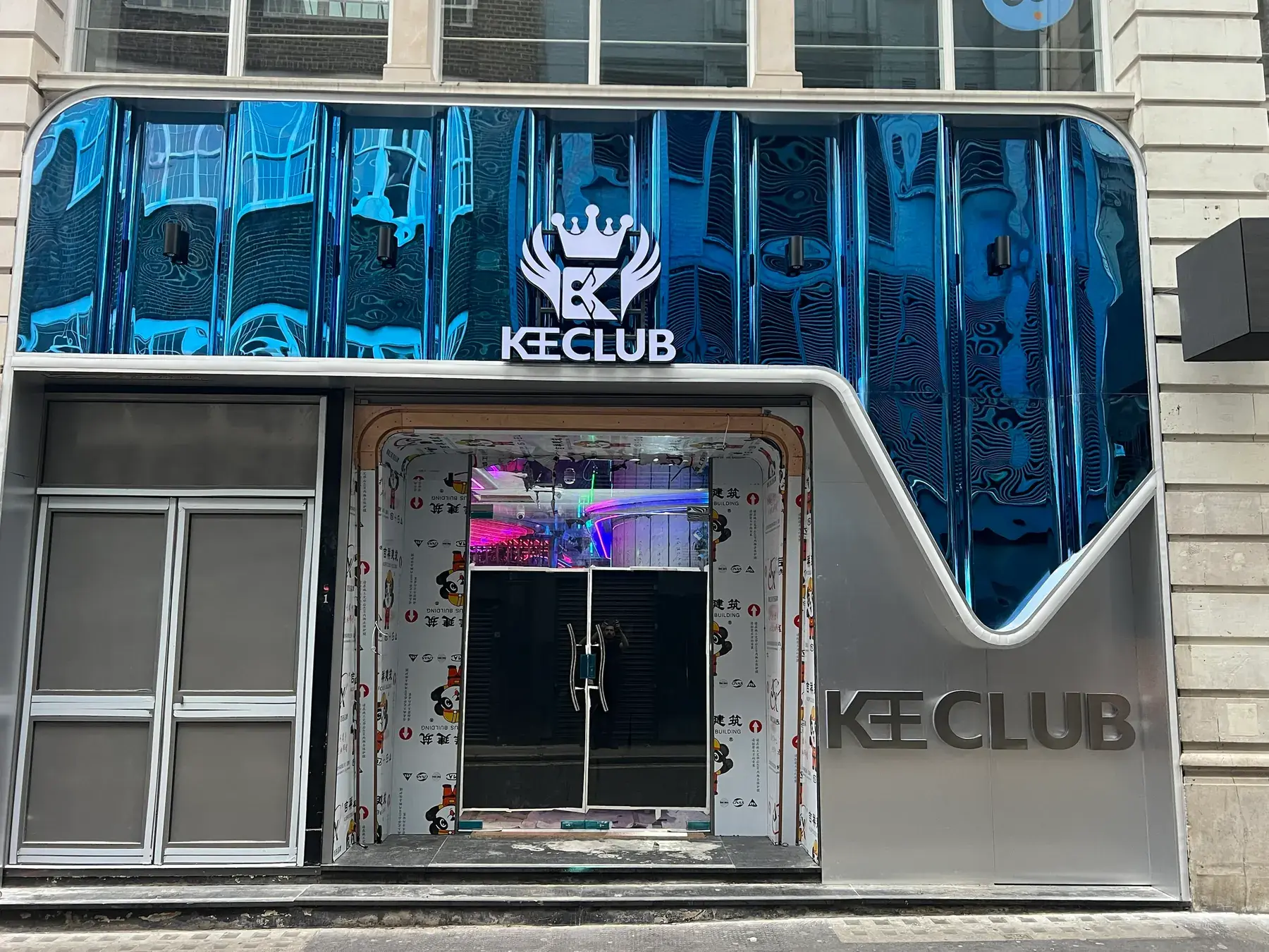 Kee Club entrance in Holborn by day: mirrored blue canopy with the crowned Kee Club logo and built-up Kee Club letters