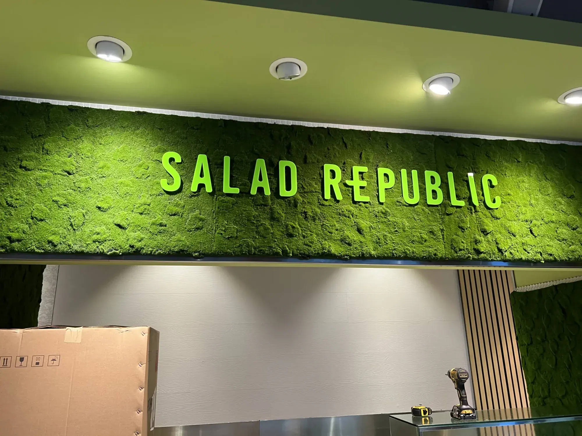 Green Salad Republic letters on a moss wall